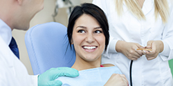 Woman in dental chair smiling