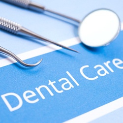 Dental instruments lying on a piece of paper that reads “Dental Care”