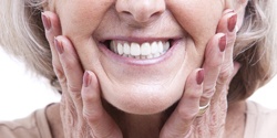 Closeup of woman with All-On-4 implant dentures in Denton