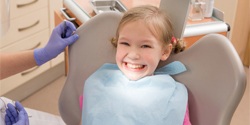 Girl smiling in dental chair