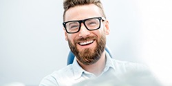 Man with attractive smile in dental chair