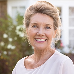 Older woman with healthy smile outdoors