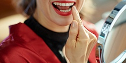 Lady admires her teeth
