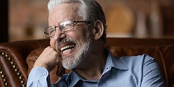 Man laughing with dentures
