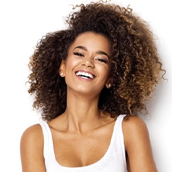 Smiling woman with direct bonding in Denton