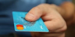Man holding credit card for payment