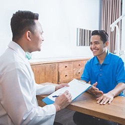 patient talking to dentist 