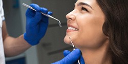 woman smiling while visiting dentist 