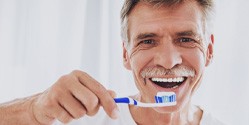 Man holding a toothbrush