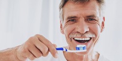 Man holding a toothbrush