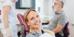 Woman smiling in the dental chair