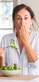 Woman eating salad