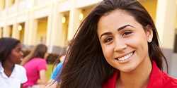 Woman in crown smiling brightly