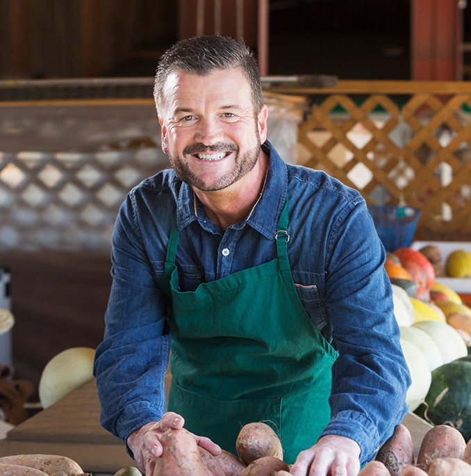 Man wearing green apron