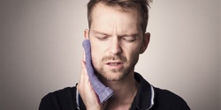 man towel jaw pain