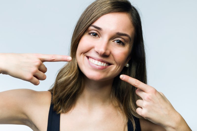 Woman smiling after teeth whitening