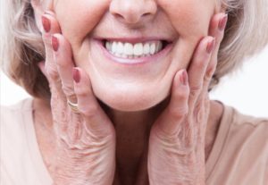 a woman smiling with dentures