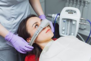 a woman receiving dental sedation during a dental treatment