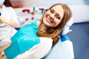Woman smiling after her oral cancer screening